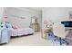 Bright bedroom boasts a playful decor, vanity, stylish mirror and plenty of natural light at 5560 Stoneleigh Dr, Suwanee, GA 30024