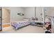 Bedroom with floral bedding, cute decor and lots of space for activities and play at 5560 Stoneleigh Dr, Suwanee, GA 30024