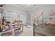Cozy bedroom features two closets, a window with curtains, a silver bed and stylish decor at 5560 Stoneleigh Dr, Suwanee, GA 30024