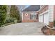 Spacious two-car garage with a concrete driveway and brick exterior at 5560 Stoneleigh Dr, Suwanee, GA 30024