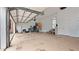 Oversized garage featuring high ceilings, storage shelves, and abundant space at 5560 Stoneleigh Dr, Suwanee, GA 30024