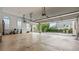 Large garage with tall ceilings, overhead storage, and plenty of space for parking at 5560 Stoneleigh Dr, Suwanee, GA 30024