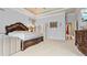 Spacious main bedroom boasts tray ceilings, recessed lighting, and ornate wood accents at 5560 Stoneleigh Dr, Suwanee, GA 30024