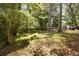 Large backyard with mature trees and lush greenery at 720 Maynard Se Ter, Atlanta, GA 30316
