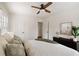 Bright bedroom with a ceiling fan, a comfortable queen size bed, and hardwood floors at 720 Maynard Se Ter, Atlanta, GA 30316