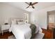 Bright bedroom with hardwood floors, a ceiling fan and a comfortable queen size bed at 720 Maynard Se Ter, Atlanta, GA 30316
