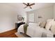 Well-lit bedroom features hardwood floors, a ceiling fan, and a comfortable queen size bed at 720 Maynard Se Ter, Atlanta, GA 30316