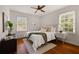 Cozy bedroom with a soft rug, a comfortable queen size bed, and two bright windows at 720 Maynard Se Ter, Atlanta, GA 30316
