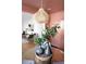 Close up of the vases on a glass table with a modern pendant light fixture hanging above at 720 Maynard Se Ter, Atlanta, GA 30316