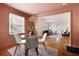 Inviting dining room with hardwood floors, a stylish light fixture, and a view to the adjacent living room at 720 Maynard Se Ter, Atlanta, GA 30316