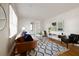 Bright living room with hardwood floors, modern furniture, a stylish rug, and natural light from the windows at 720 Maynard Se Ter, Atlanta, GA 30316