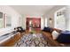 Cozy living room showcasing hardwood floors, contemporary furniture, and an open view to the dining area at 720 Maynard Se Ter, Atlanta, GA 30316