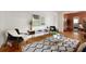 Stylish living room featuring hardwood floors, contemporary furniture, and open view to the dining room at 720 Maynard Se Ter, Atlanta, GA 30316