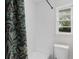 Bright bathroom featuring shower-tub combination, and natural light at 1755 Rockbridge Nw Rd, Conyers, GA 30012