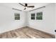 Inviting bedroom with wood-look floors and windows providing ample natural light at 1755 Rockbridge Nw Rd, Conyers, GA 30012