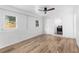 Bright bedroom with wood-look floors, neutral paint, and ample natural light at 1755 Rockbridge Nw Rd, Conyers, GA 30012