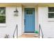 Close up of the home's bright blue front door with modern hardware and house number at 1755 Rockbridge Nw Rd, Conyers, GA 30012