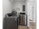 Convenient laundry room with modern washer and dryer and storage space at 1755 Rockbridge Nw Rd, Conyers, GA 30012