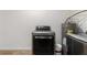 Newer model dryer in a well maintained laundry area at 1755 Rockbridge Nw Rd, Conyers, GA 30012