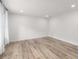 Bright, open living room featuring new hardwood flooring and recessed lighting at 1755 Rockbridge Nw Rd, Conyers, GA 30012