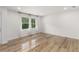 Bright room features light hard wood flooring, recessed lights and fresh white paint at 1755 Rockbridge Nw Rd, Conyers, GA 30012
