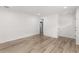 Spacious living room with modern hard wood flooring and fresh white paint at 1755 Rockbridge Nw Rd, Conyers, GA 30012