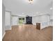 Open living area features wood floors, decorative fireplace, a kitchen and lots of light at 1829 Herringbone Holw, Lithonia, GA 30058