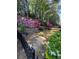 The yard features colorful flowers and trees at 3025 Woodwalk Se Dr # 17, Atlanta, GA 30339