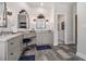 Spa-like bathroom with custom mirrors, vanity, and wood-look tile flooring at 3025 Woodwalk Se Dr # 17, Atlanta, GA 30339