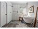 Stylish bathroom showcasing a freestanding tub with shower head and patterned tile at 3025 Woodwalk Se Dr # 17, Atlanta, GA 30339