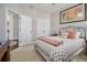 A cozy bedroom features a metal bed frame, soft carpeting, and a doorway leading to another room at 3025 Woodwalk Se Dr # 17, Atlanta, GA 30339