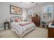 Comfortable bedroom with neutral decor, plantation shutters, and traditional furnishings at 3025 Woodwalk Se Dr # 17, Atlanta, GA 30339