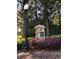 Entrance stone sign in a flower garden at 3025 Woodwalk Se Dr # 17, Atlanta, GA 30339