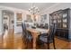 Spacious dining room with hardwood floors, stylish furniture, and elegant lighting for memorable gatherings at 3025 Woodwalk Se Dr # 17, Atlanta, GA 30339