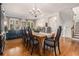 Spacious dining room features hardwood floors, chandelier, and ample space for gathering and entertaining at 3025 Woodwalk Se Dr # 17, Atlanta, GA 30339