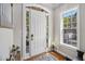 Inviting entryway featuring a white door with sidelights and transom window allowing for plenty of natural light at 3025 Woodwalk Se Dr # 17, Atlanta, GA 30339