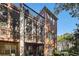 Exterior back elevation of the brick homes with patios and screened in porches at 3025 Woodwalk Se Dr # 17, Atlanta, GA 30339