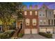 Beautiful brick townhome featuring a two-car garage and welcoming front porch at 3025 Woodwalk Se Dr # 17, Atlanta, GA 30339