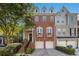 Charming brick townhome with an inviting entrance and two-car garage, offering modern comfort and curb appeal at 3025 Woodwalk Se Dr # 17, Atlanta, GA 30339