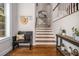 Welcoming foyer with hardwood floors, coat rack, and staircase, creating a warm and inviting ambiance at 3025 Woodwalk Se Dr # 17, Atlanta, GA 30339