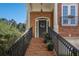 Brick front porch with wrought iron railing and columned entry evokes old world Southern Charm at 3025 Woodwalk Se Dr # 17, Atlanta, GA 30339