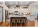Bright kitchen featuring stainless steel appliances, white cabinetry, and an island with counter seating at 3025 Woodwalk Se Dr # 17, Atlanta, GA 30339