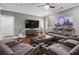 Comfortable living room featuring reclining sofa, coffee table, and entertainment center at 3025 Woodwalk Se Dr # 17, Atlanta, GA 30339
