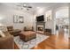 Inviting living room featuring a cozy fireplace, hardwood floors, and comfortable seating for relaxing evenings at 3025 Woodwalk Se Dr # 17, Atlanta, GA 30339