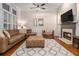 Cozy living room features a fireplace, plush seating, and natural light for ultimate relaxation at 3025 Woodwalk Se Dr # 17, Atlanta, GA 30339