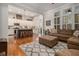 Inviting living room seamlessly flows into a spacious kitchen with a large island and breakfast bar at 3025 Woodwalk Se Dr # 17, Atlanta, GA 30339