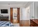 A view from the main bedroom shows a bathroom with sliding barn doors and a view of another room at 3025 Woodwalk Se Dr # 17, Atlanta, GA 30339