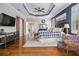 Spacious primary suite with tray ceilings, hardwood floors, and sitting area at 3025 Woodwalk Se Dr # 17, Atlanta, GA 30339