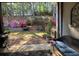 View of the backyard from a covered patio, with seating and an outdoor grill at 3025 Woodwalk Se Dr # 17, Atlanta, GA 30339