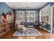 Sitting room with many windows, hardwood floors, and a bookcase at 3025 Woodwalk Se Dr # 17, Atlanta, GA 30339
